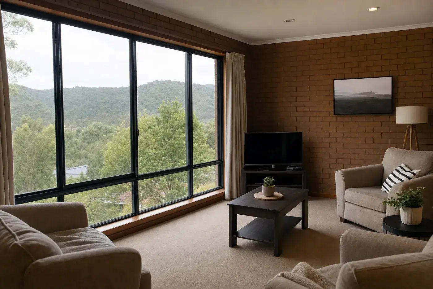 Living room of a 1970s brick house with black aluminium double glazed windows