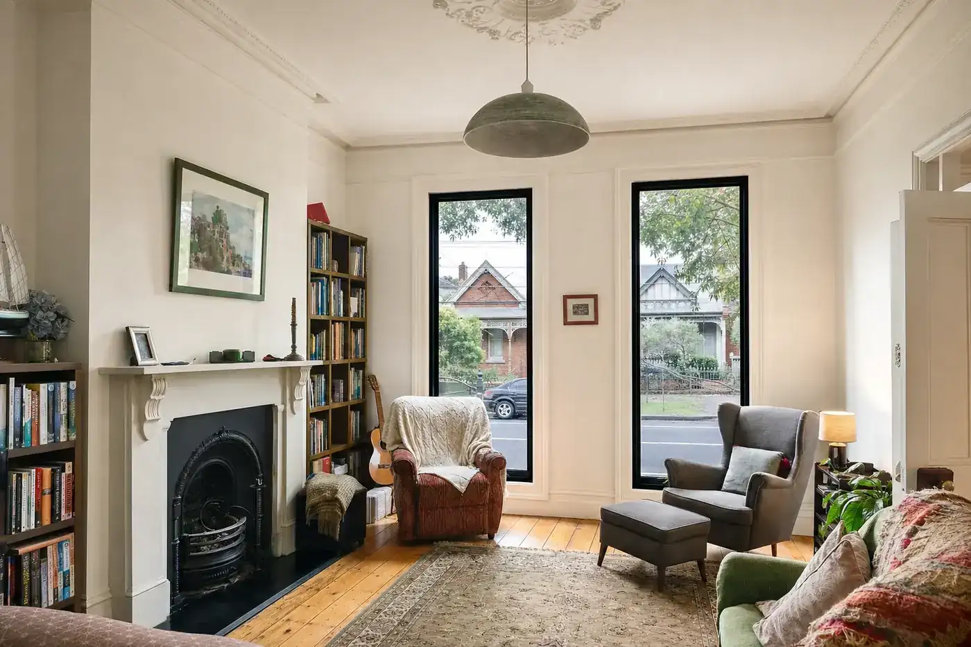 Front sitting room of a single-fronted Victorian villa with black aluminium double glazed windows