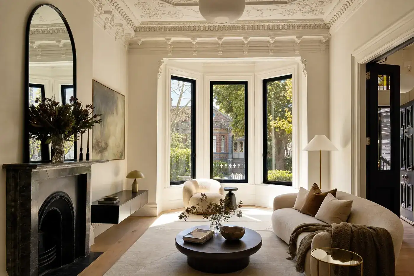 Period home bay window fitted with new black aluminium double glazed windows